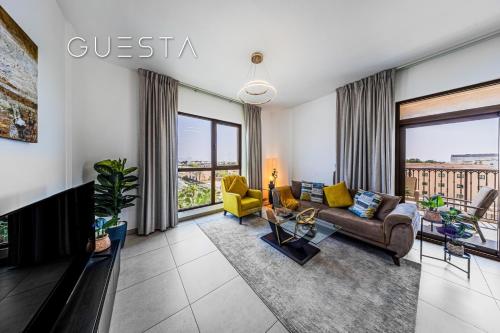 a living room with a couch and chairs and windows at Lamtara 1 - Madinat Jumeirah Living, Jumeirah in Dubai