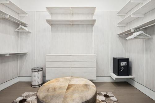 a room with a circular table in the middle at Luxury New Modern Beach Mansion in BEST Location! in Jupiter