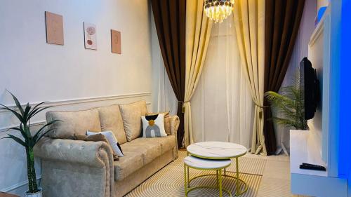 a living room with a couch and a table at Prima Lodge Homestay in Kulim