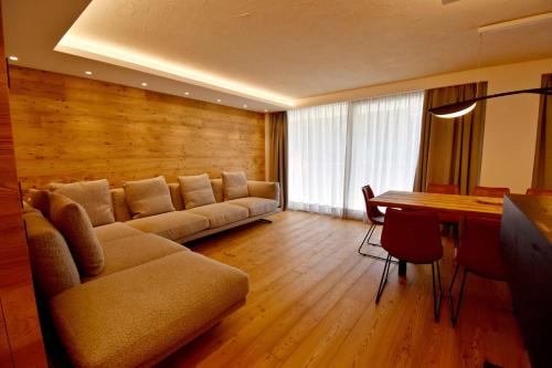 Area soggiorno di BRENTA ALTA ALPINE LODGE MhD