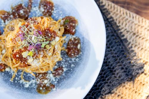 a plate of spaghetti with meatballs and sauce at Karongwe - Kuname Safari Lodge in Hoedspruit