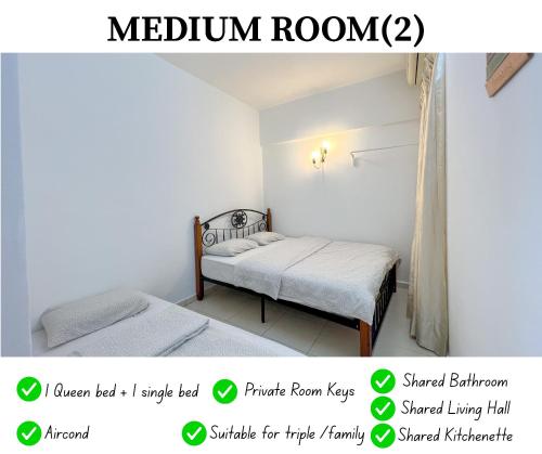 Ένα ή περισσότερα κρεβάτια σε δωμάτιο στο Maison Seaview Suites Port Dickson