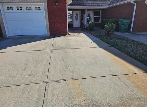 a driveway in front of a house with a garage at Beach Breeze Getaway in Destin
