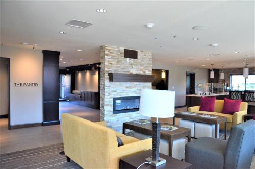 a lobby of a hotel with a fireplace at Staybridge Suites - Orenco Station by IHG in Hillsboro