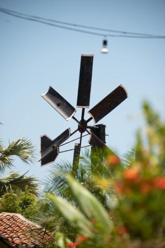a drone flying in the sky over some plants at Pousada Catavento in São Gonçalo do Amarante