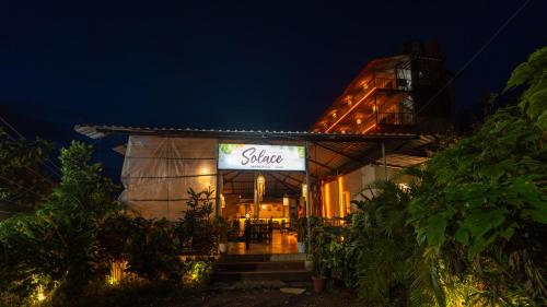 a restaurant with a sign that reads shine at night at Seaview Rooms at Mandrem in Mandrem