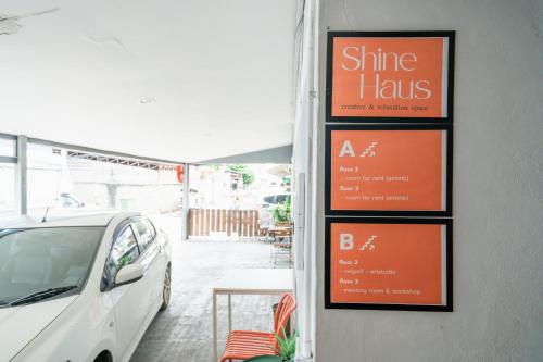 a white car parked in front of a restaurant at Dec Room at Shine Haus BangSue in Bang Su