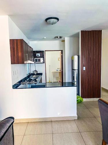 a kitchen with a white counter top in a room at Ocean Majesty in Playa Blanca