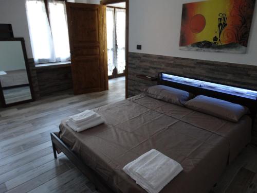 Ένα ή περισσότερα κρεβάτια σε δωμάτιο στο Casa Vacanze La casa di Astrid