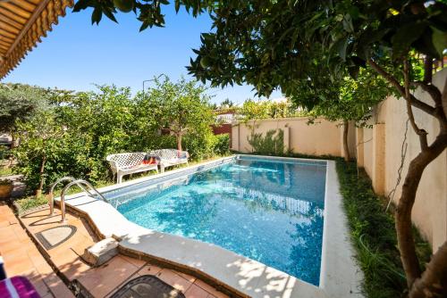 a swimming pool in the backyard of a house at Vila Rroshaj in Tirana