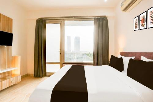 Ένα ή περισσότερα κρεβάτια σε δωμάτιο στο Hotel O AR SUITES