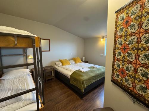 Postel nebo postele na pokoji v ubytování Berunes HI Hostel