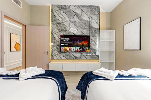 Ein Bett oder Betten in einem Zimmer der Unterkunft Desert Key - Perfectly Located Yas Island Premier Apts
