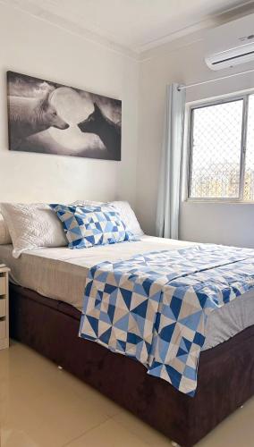Llit o llits en una habitació de Apartamento COP30