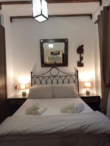 Postel nebo postele na pokoji v ubytování Apto CENTRO HISTORICO MEDIEVAL