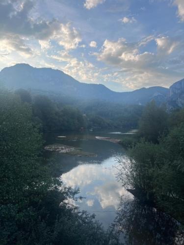 a view of a river with mountains in the background at Ferienhaus LAGUM in Rudo