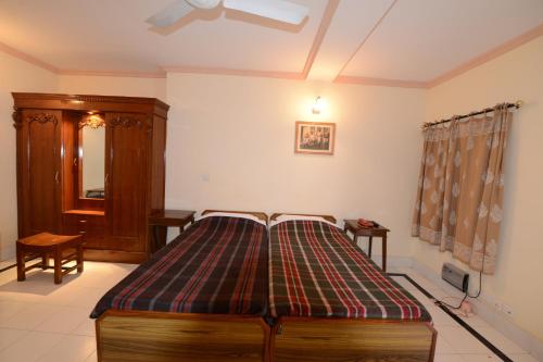 Cama o camas de una habitación en Hotel Jaswant Bhawan
