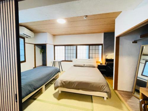 Ένα ή περισσότερα κρεβάτια σε δωμάτιο στο Stay Narimasu - 3rooms Apartment, 4min to Narimasu station, 1min to Donki