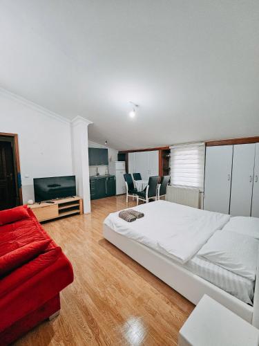 En eller flere senge i et værelse på Central Duplex Suite