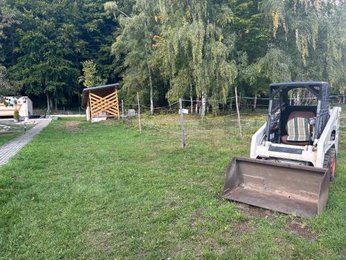 a pile of equipment sitting on the grass in a field at Relaxmobilhouse in Litvínov