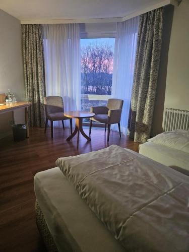 Ένα ή περισσότερα κρεβάτια σε δωμάτιο στο Rheinhotel Larus
