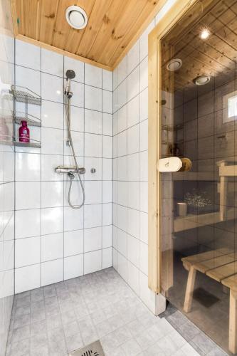 a bathroom with a shower with a glass door at Ylläs Kajo in Ylläsjärvi