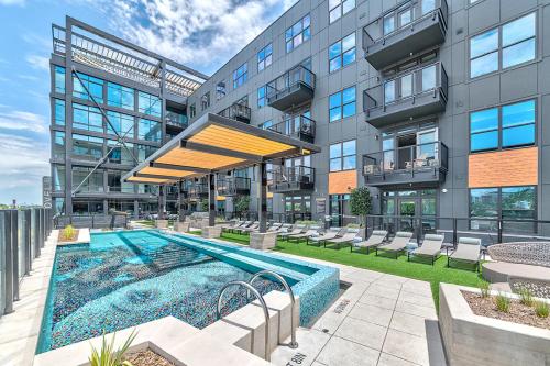 a building with a swimming pool in front of a building at Deep Ellum Theatre Suite - The Black Collection in Dallas