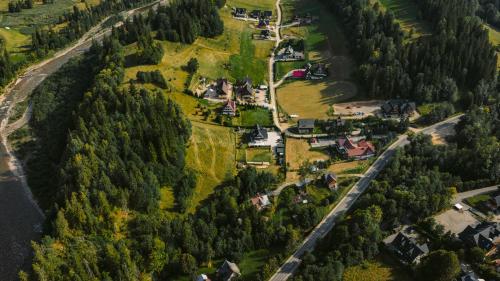 an aerial view of a village in a forest at Gościniec Grandel in Bukowina Tatrzańska