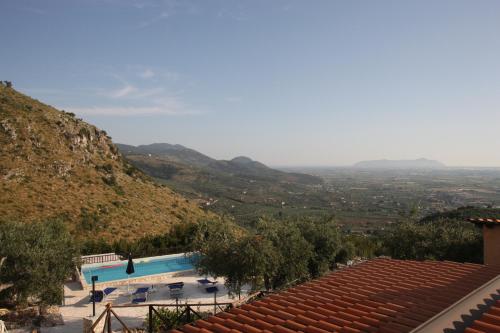 a view of a swimming pool with mountains in the background at Tenuta Palma in Sonnino