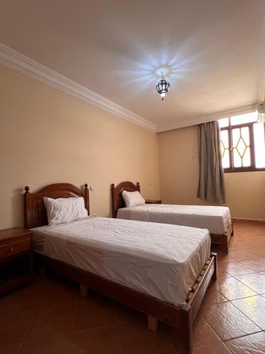 Una cama o camas en una habitación de Hotel Ourida Zagora
