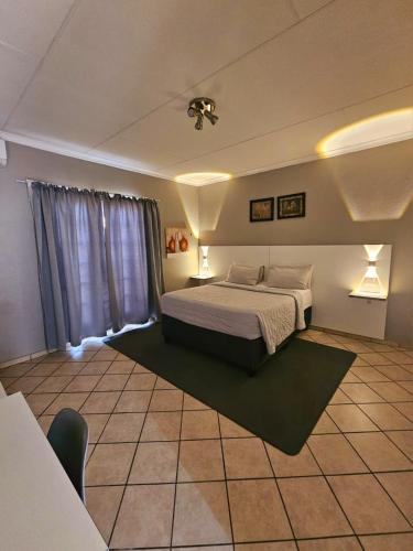 a large bedroom with a bed and a window at ZUCH Accommodation at Pafuri Self Catering - Guest Apartment in Polokwane