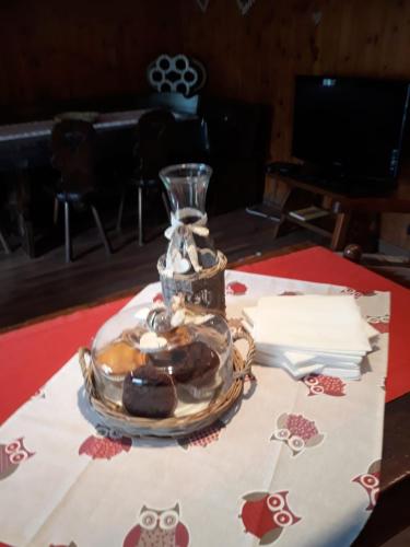 a table with a jar of chocolate cookies on it at CA' VIRASOLELH in Macra
