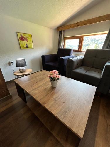 a living room with a coffee table and a couch at Villa ANA-Mavrovo in Mavrovo