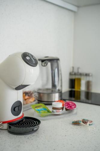 a coffee maker sitting on a kitchen counter at Love room à 30 mn des plages et de Vannes in Questembert