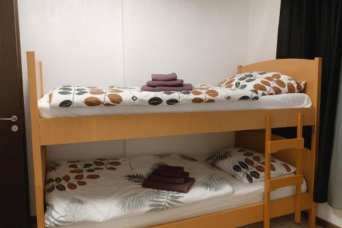Postel nebo postele na pokoji v ubytování Apartman 1001
