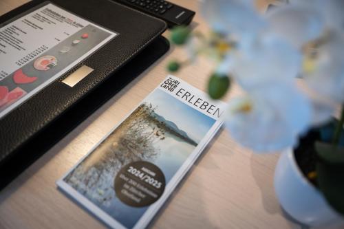 a book sitting on top of a wooden table at Hotel Ochsen in Uster