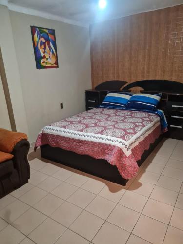 a bedroom with a bed in a room at Casita entre los cerros in Sucre