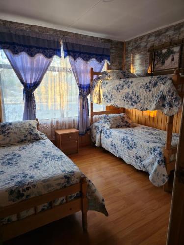Postel nebo postele na pokoji v ubytování Hostal Josmar Natales