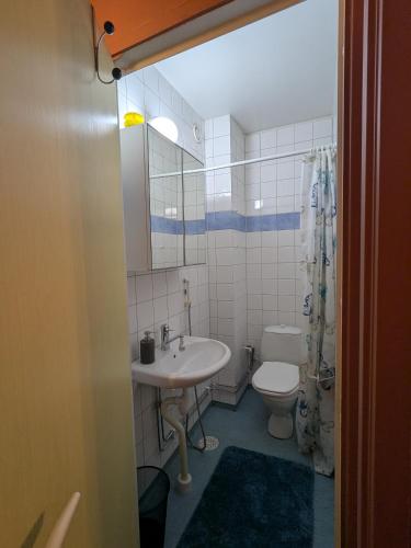 a bathroom with a sink and a toilet at City Nook in Stockholm