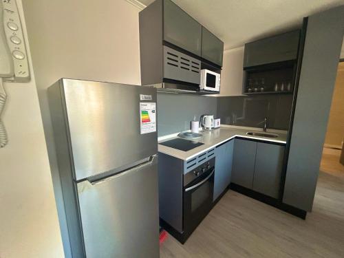 Kuchyň nebo kuchyňský kout v ubytování Ñuñoa I Cercano a Metro con Estacionamiento