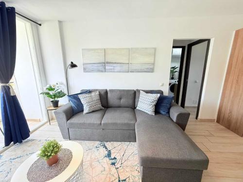 a living room with a couch and a table at HDFM Collection - Yumbo Paradise in Playa del Ingles