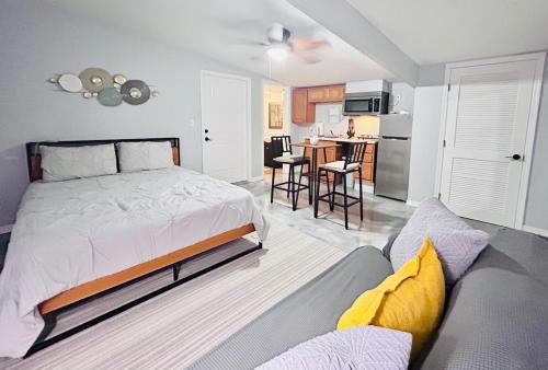 a bedroom with a bed and a kitchen at The Perfect One Night Stay in Jacksonville