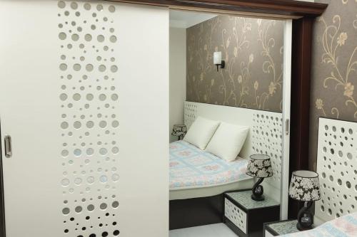 Ένα ή περισσότερα κρεβάτια σε δωμάτιο στο Marhaba