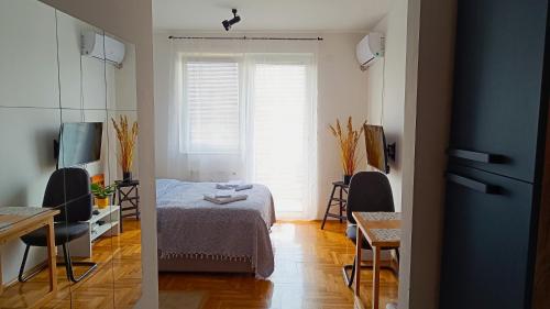 Ένα ή περισσότερα κρεβάτια σε δωμάτιο στο Terminal