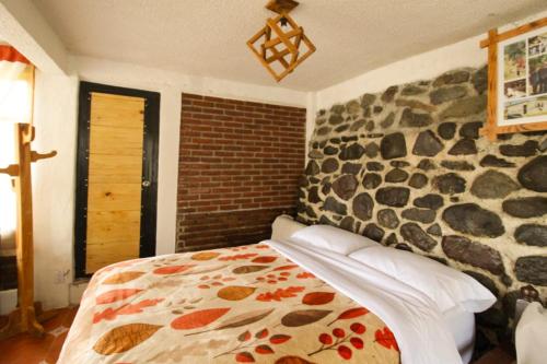 Postel nebo postele na pokoji v ubytování Hospedaje Rancho La Joya