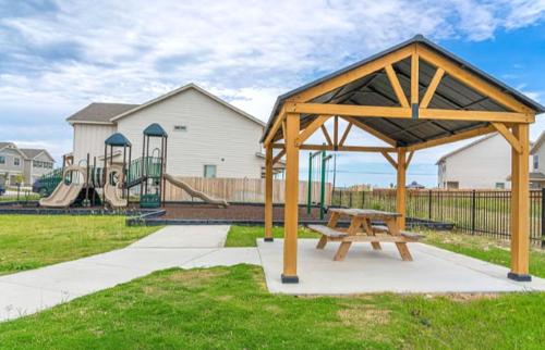 a park with a picnic table and a playground at Book Now! Elegant Spacious Near Fun Attractions in Helotes