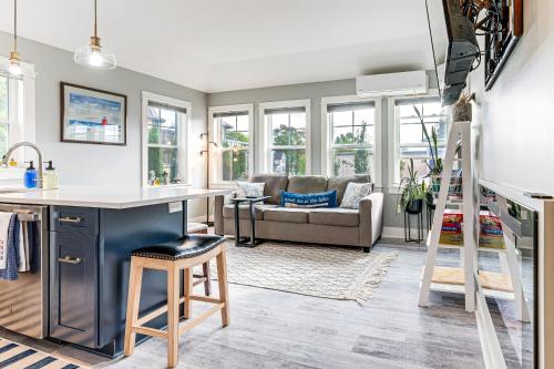 a kitchen and living room with a couch at Walk to Dtwn Charlevoix Condo with Fireplace in Charlevoix