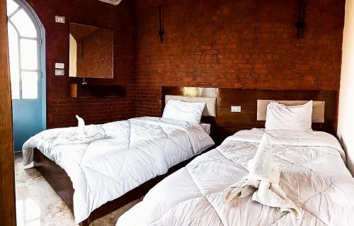 Ένα ή περισσότερα κρεβάτια σε δωμάτιο στο Flower of life guest house