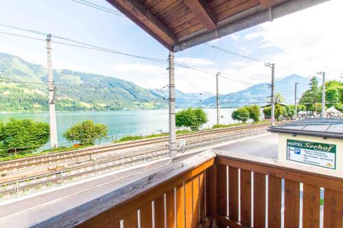 a train station with a view of the water at Ski-n-Lake City Apartments in Zell am See