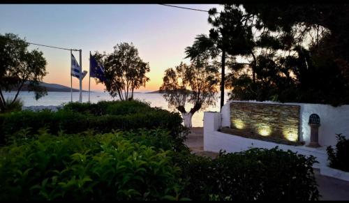 a building with a window with a view of the ocean at Enigma Boutique Houses Ammos in Marmarion